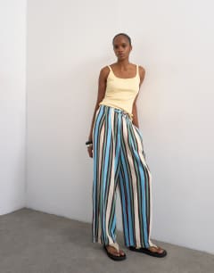 Model wearing Linen balloon trouser with tie waist in verigated stripes