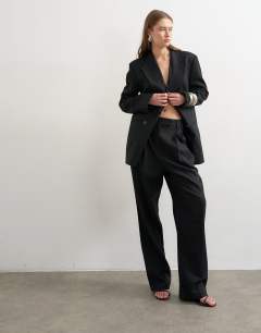 Model wearing Linen barrel leg trouser in black