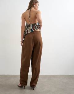Model wearing Linen barrel leg trouser in brown