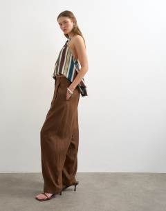 Model wearing Linen barrel leg trouser in brown
