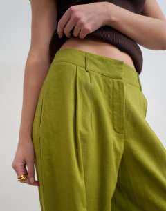 Model wearing Linen barrel leg trouser in green