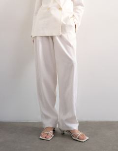Model wearing Linen barrel leg trouser in white