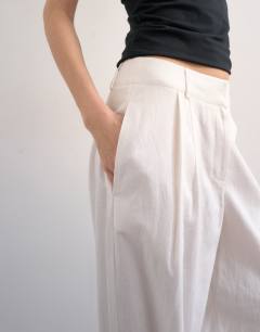 Model wearing Linen barrel leg trouser in white