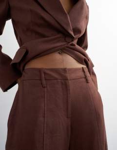 Model wearing Linen blend co ord occasion barrel leg trouser in chocolate