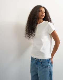Model wearing Linen blend fitted short sleeve henley in white