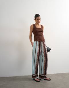 Model wearing Linen blue painted stripe straight leg trouser with deep cuff in blue