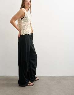 Model wearing Linen cargo trouser in black