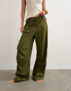 Model wearing Linen cargo trouser in khaki