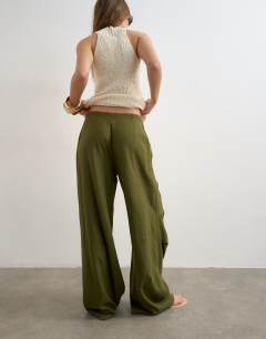 Model wearing Linen cargo trouser in khaki