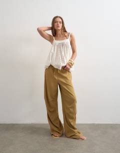 Model wearing Linen cargo trouser in tan