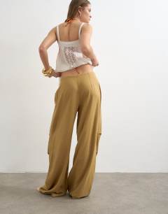 Model wearing Linen cargo trouser in tan