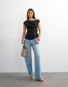 Model wearing Linen cinched waist asymmetric twist shoulder top in black