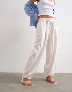 Model wearing Linen elasticated waist balloon trouser in white