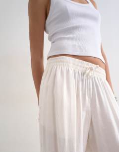 Model wearing Linen elasticated waist balloon trouser in white