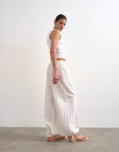 Model wearing Linen elasticated waist balloon trouser in white