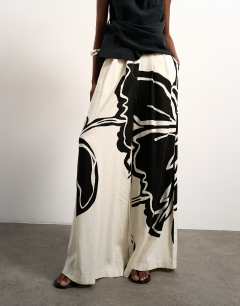 Model wearing Linen floral placement wide leg trouser in ecru