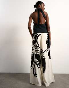 Model wearing Linen floral placement wide leg trouser in ecru