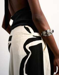 Model wearing Linen floral placement wide leg trouser in ecru