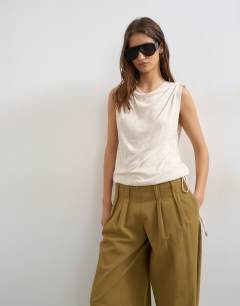 Model wearing Linen look cowl ruched side top in cream