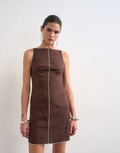Model wearing Linen mini shift dress in brown with top stitch