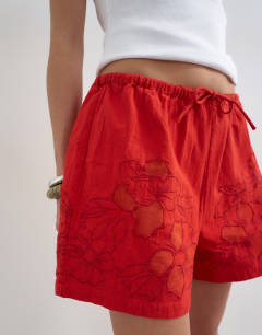 Model wearing Linen mini short with drawcord in red