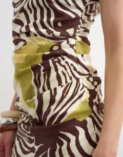 Model wearing Linen rich drape asymmetric mini dress in khaki and brown abstract animal print