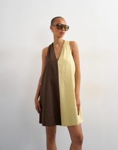 Model wearing Linen rich halter deep hem mini trapeze dress in brown and lime colour block