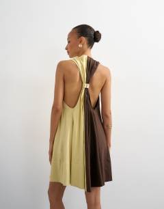 Model wearing Linen rich halter deep hem mini trapeze dress in brown and lime colour block