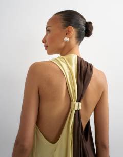 Model wearing Linen rich halter deep hem mini trapeze dress in brown and lime colour block