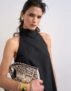 Model wearing Linen rich high neck trapeze mini dress in black