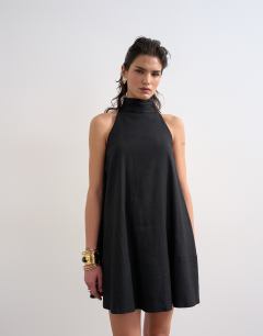 Model wearing Linen rich high neck trapeze mini dress in black