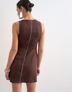 Model wearing Linen rich mini shift dress in brown with top stitch