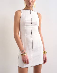 Model wearing Linen rich mini shift dress in ecru with top stitch