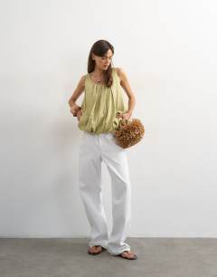 Model wearing Linen rich twist bubble hem chuck on cami in sage green