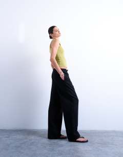 Model wearing Linen straight leg trouser with deep cuff in black