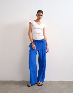 Model wearing Linen straight leg trouser with deep cuff in cobalt