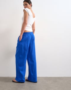 Model wearing Linen straight leg trouser with deep cuff in cobalt