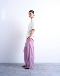 Model wearing Linen straight leg trouser with deep cuff in purple