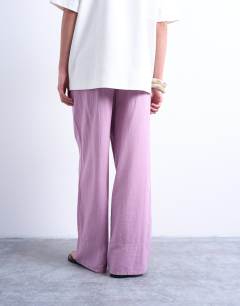 Model wearing Linen straight leg trouser with deep cuff in purple