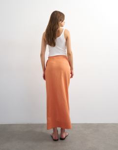 Model wearing Linen wrap maxi skirt in dusted clay