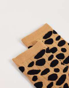 Model wearing Lola viscose socks in animal print