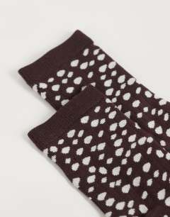 Model wearing Lola viscose socks in chocolate deer print