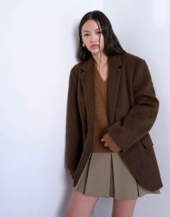 Model wearing Long brushed one button blazer coat with wool in chocolate