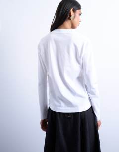 Model wearing Long sleeve boxy tee in white