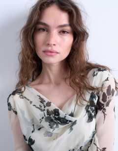 Model wearing Long sleeve cowl neck mini tea dress in mono floral