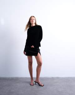 Model wearing Long sleeve drape neck velvet top in black