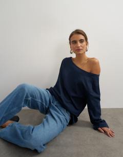 Model wearing Long sleeve fallen shoulder top in navy