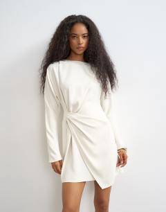 Model wearing Long sleeve high neck tuck side mini dress in off white