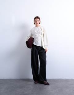 Model wearing Long sleeve pleat front top in ivory