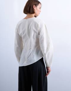 Model wearing Long sleeve pleat front top in ivory